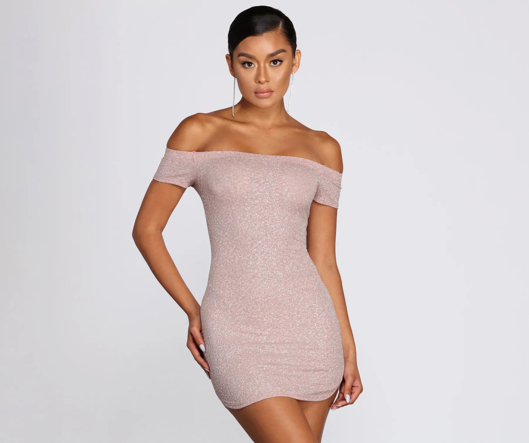 Mini dresses with bow accents for a sweet look Round And Round Glitter Dress