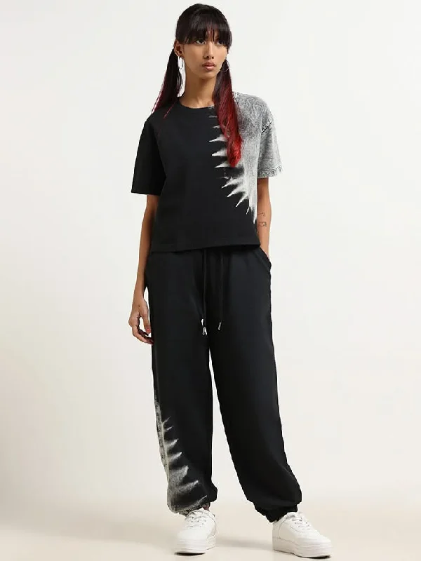 Women's budget - friendly denim pants Button - fly women jeans with a traditional touch Studiofit Black Printed Cotton Joggers