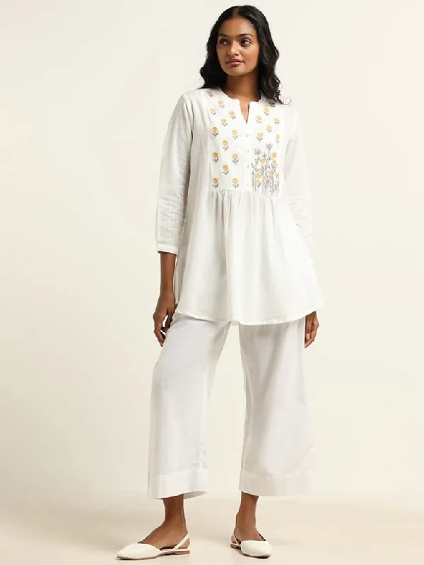 Women's unisex - style casual pants Ripped women jeans for a rebellious and fashion - forward style Utsa White Embroidered Kurti