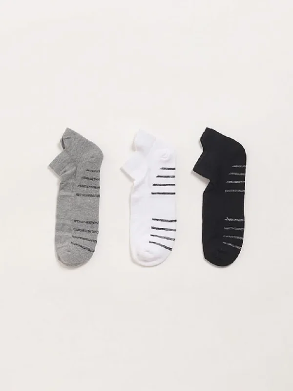 Women's low - rise denim pants Distressed women jeans for a trendy and edgy look WES Lounge Multicolour Cotton Blend Trainer Socks - Pack of 3