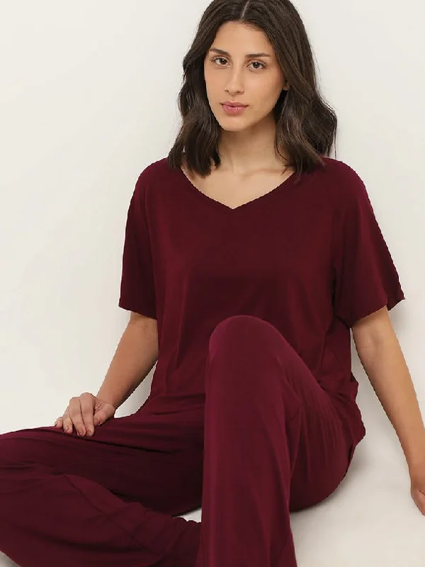 Women's pants for cocktail parties Distressed women jeans for a trendy and edgy look Wunderlove Burgundy V-Neck Supersoft T-Shirt